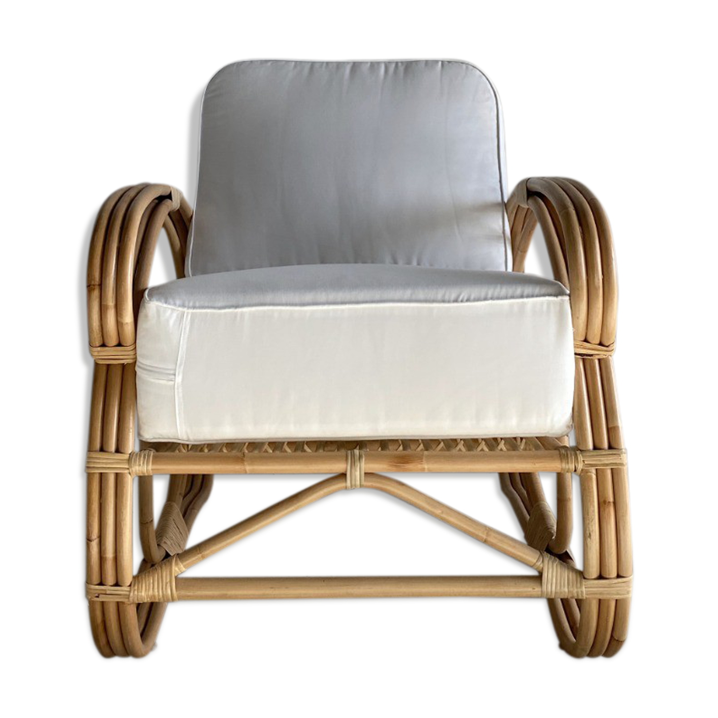 Large rattan rest chair and white cushions