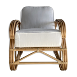 Large rattan rest chair and white cushions