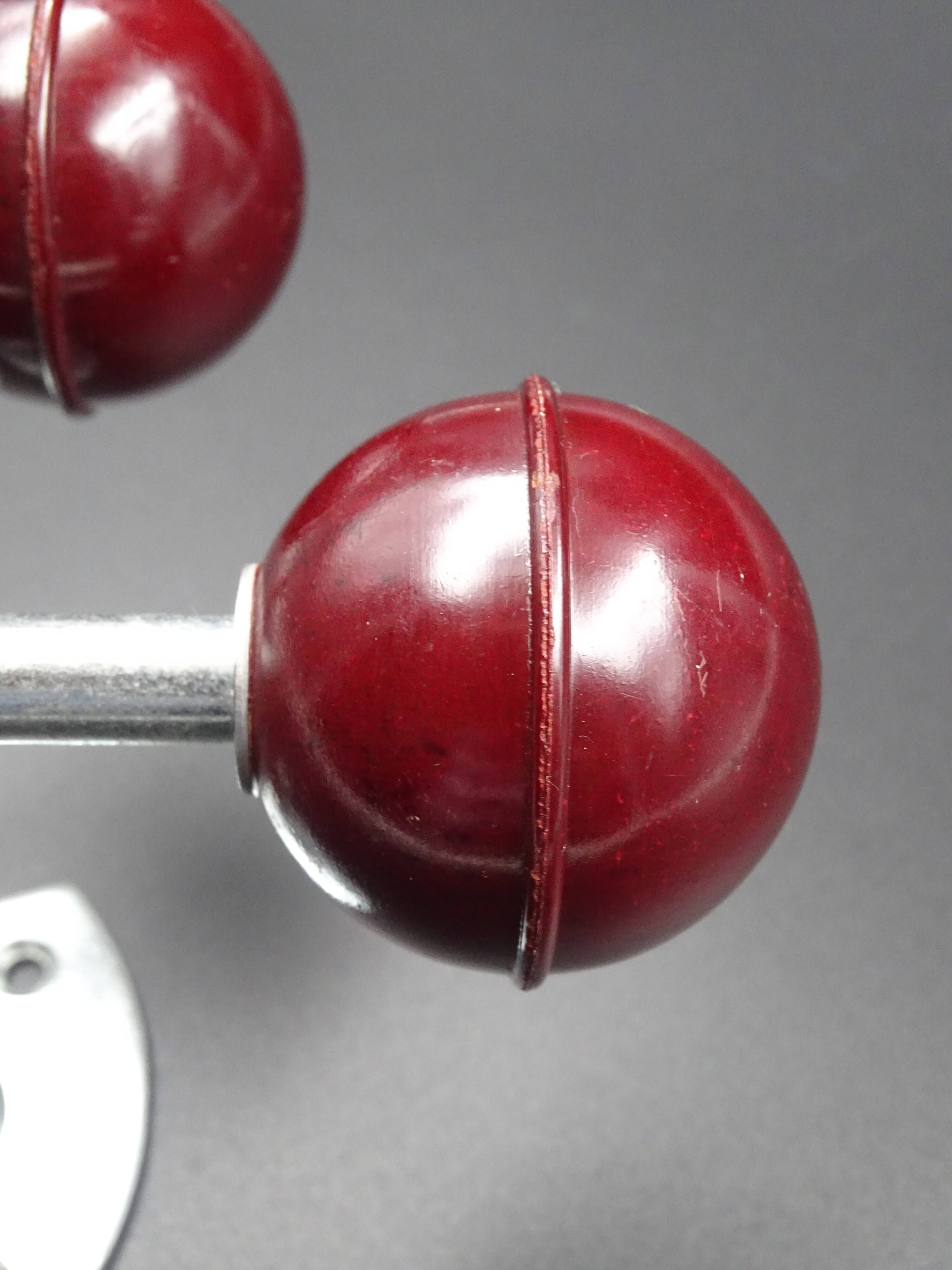 Two hooks in red bakelite and metal - around 1950