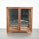 Antique Dutch oak display cabinet with glass shelves and a mirrored back