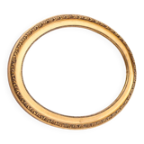 Miroir ovale dans un cadre doré, France, première moitié du XXe siècle.