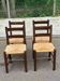 4 solid oak chairs in dark colour with elephant upholstery.
