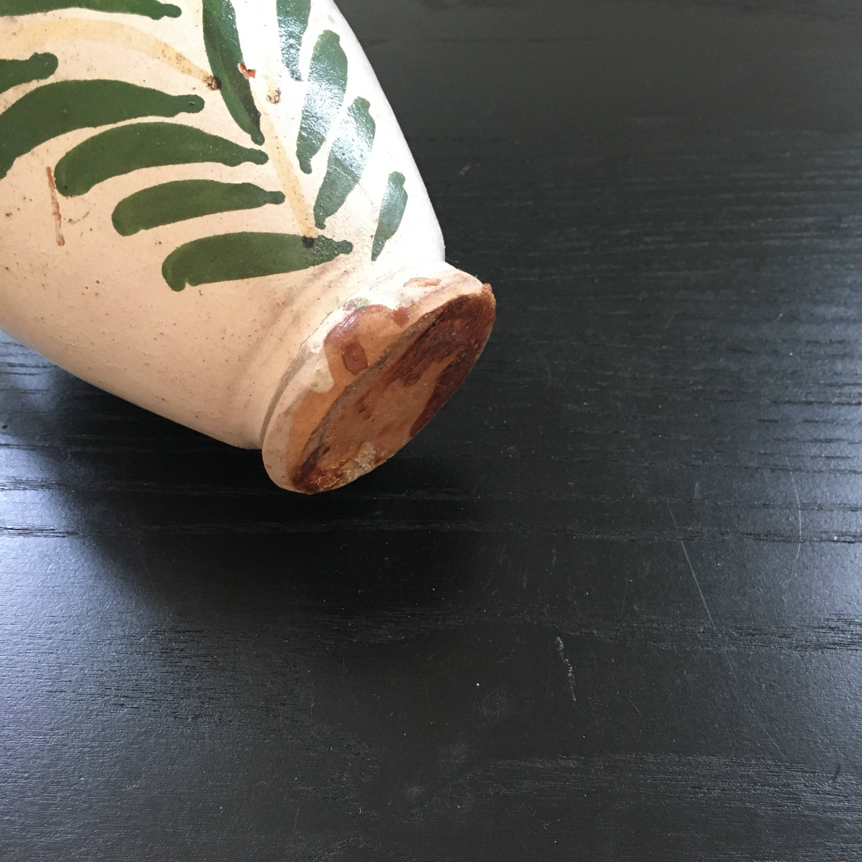 Small old amphora with floral decoration