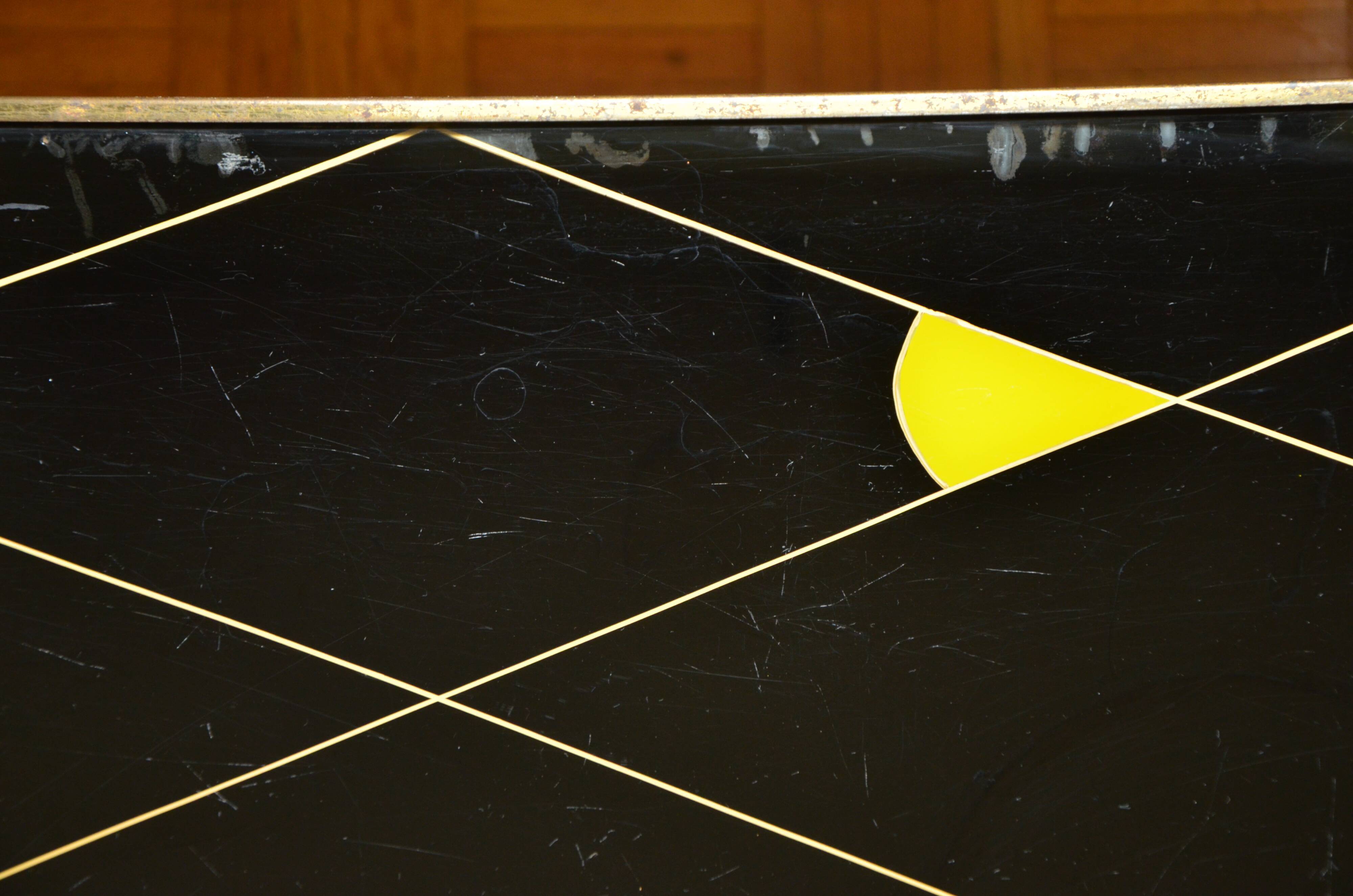 Brass and glass coffee table with compass feet