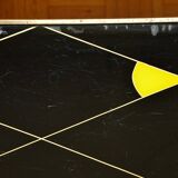 Brass and glass coffee table with compass feet