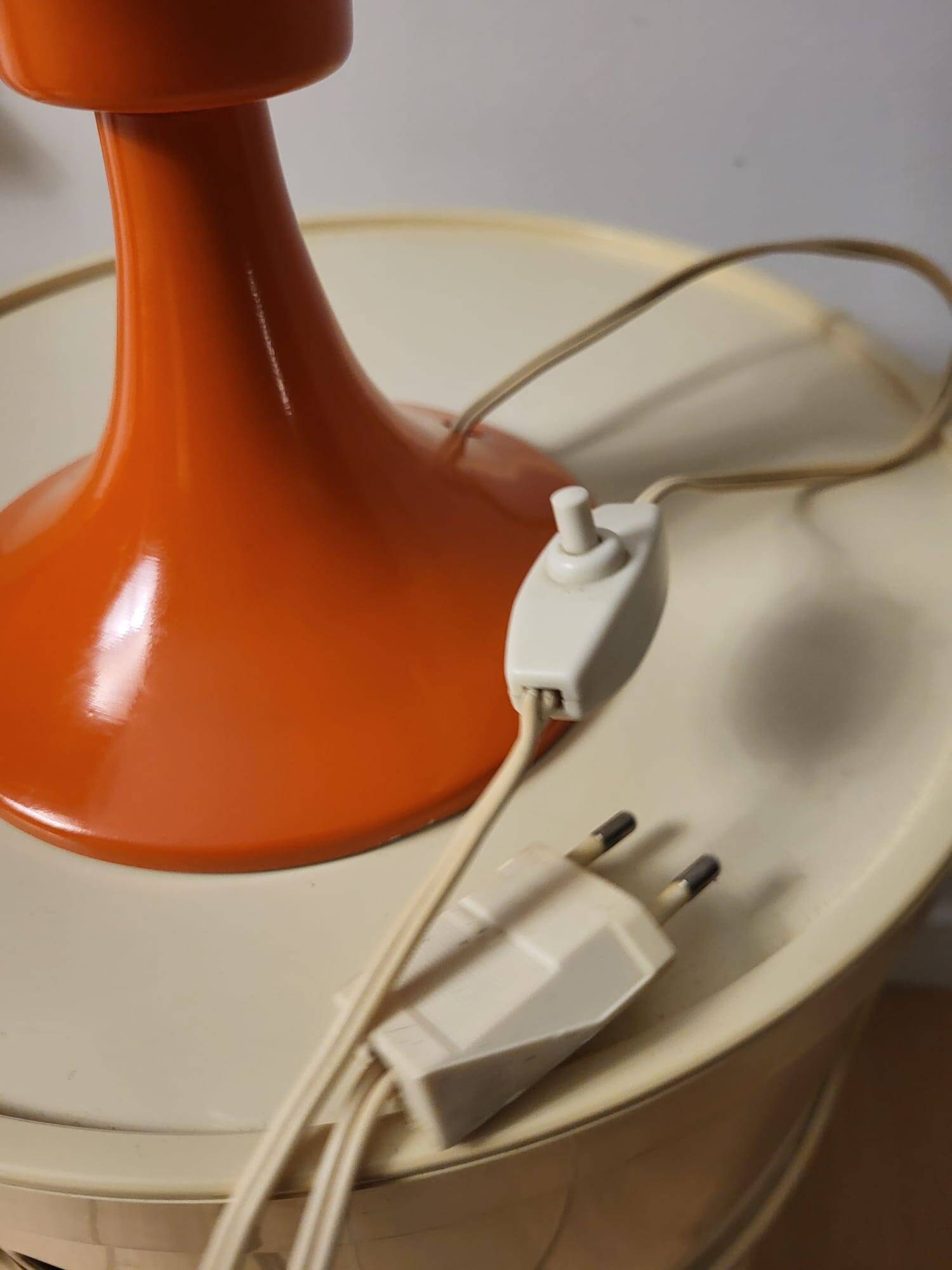 Orange metal and glass table lamp, circa 1960.