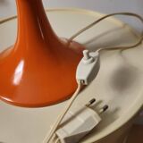 Orange metal and glass table lamp, circa 1960.