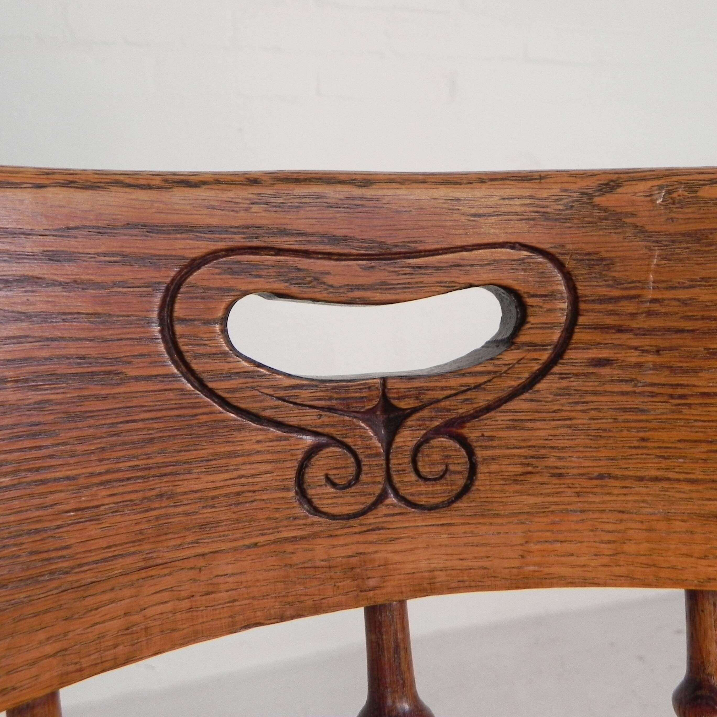 Oak office chair with a spring system and height adjustable, 1930s.