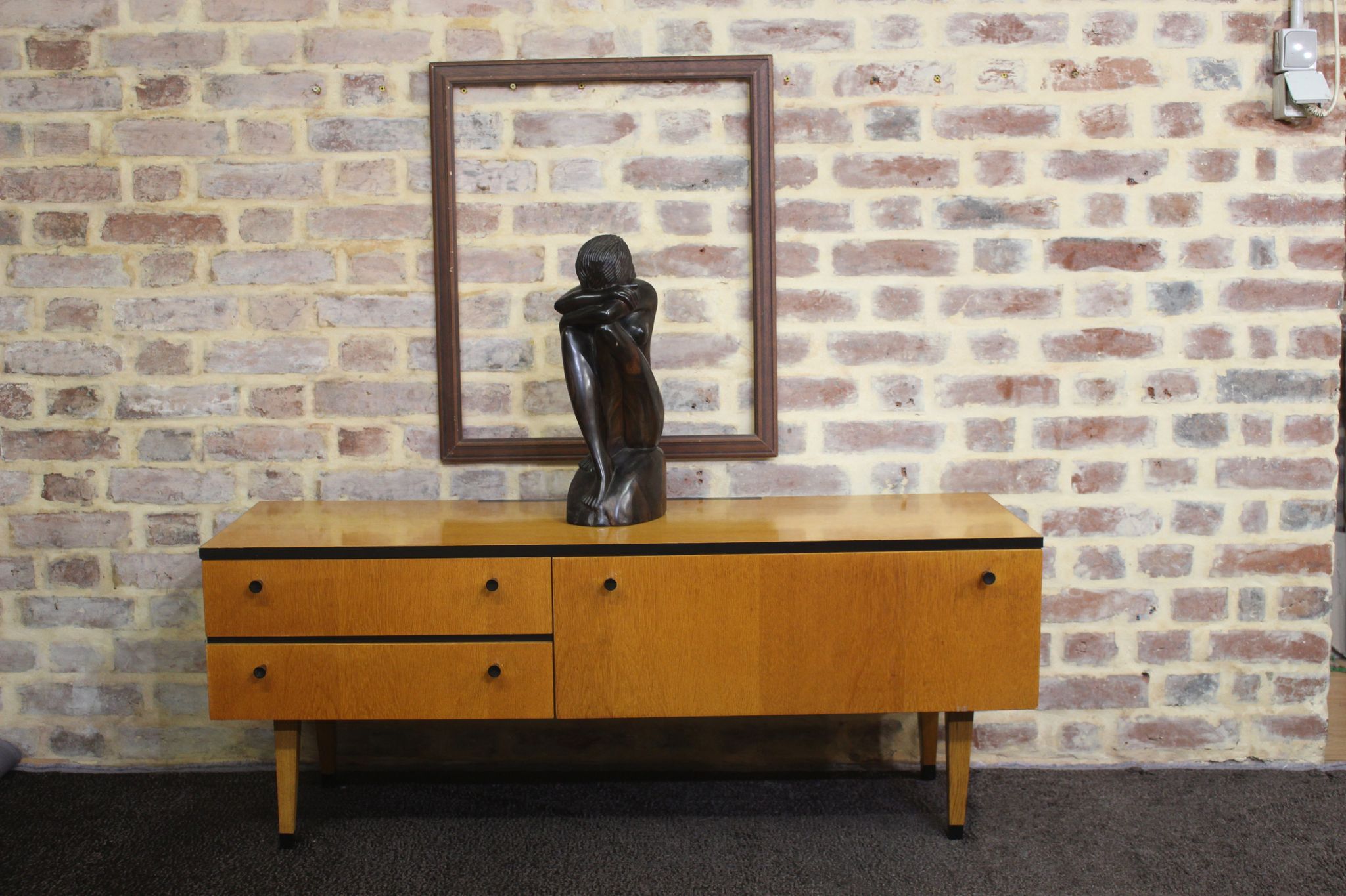 Black-gloved 50s varnished wooden sideboard
