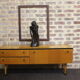Black-gloved 50s varnished wooden sideboard
