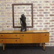 Black-gloved 50s varnished wooden sideboard