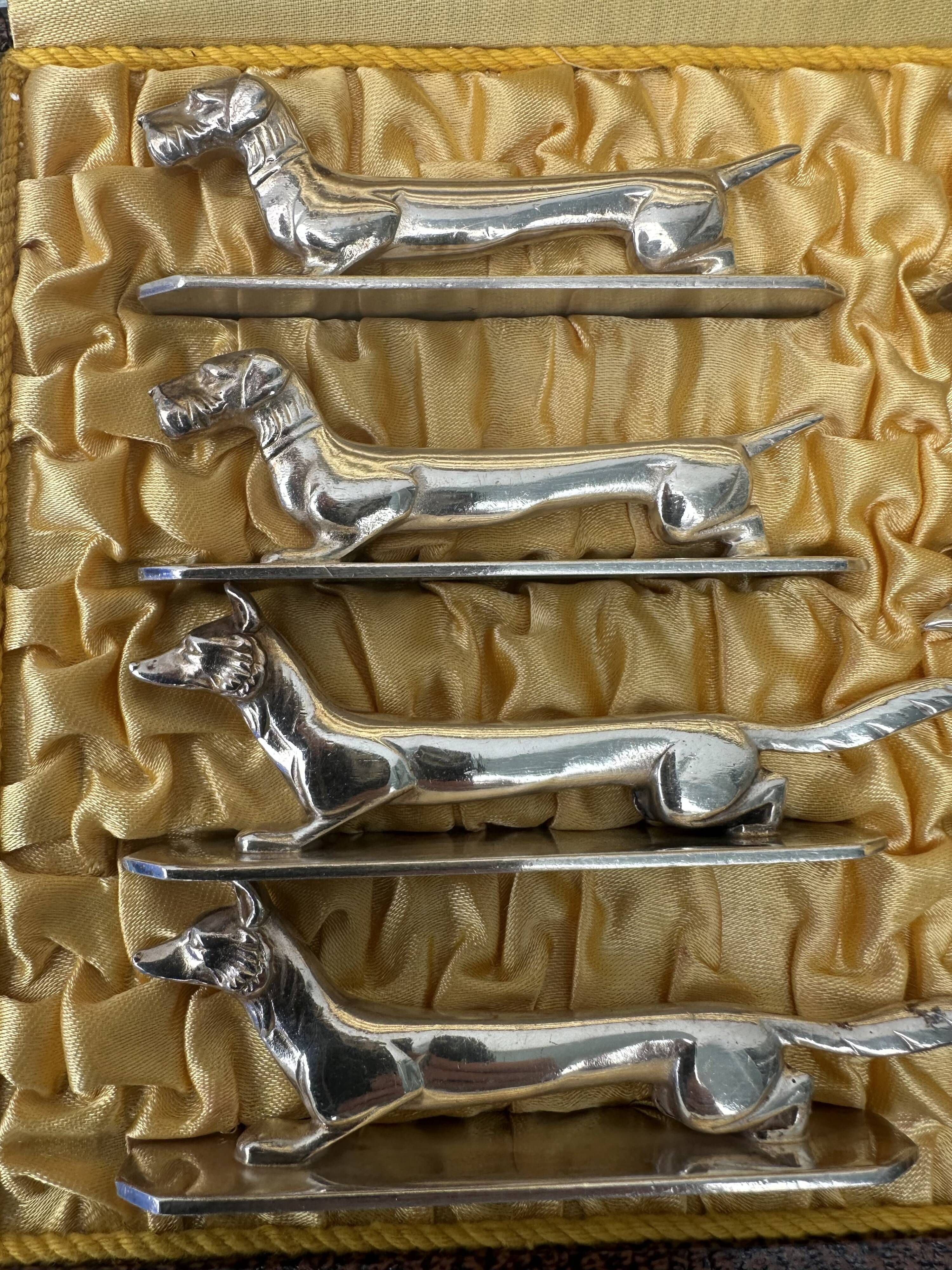 12 antique silver-plated bronze knife rests in modern art deco animal designs.