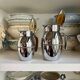 2 Hermès insulated jugs in chrome metal and covered leather.
