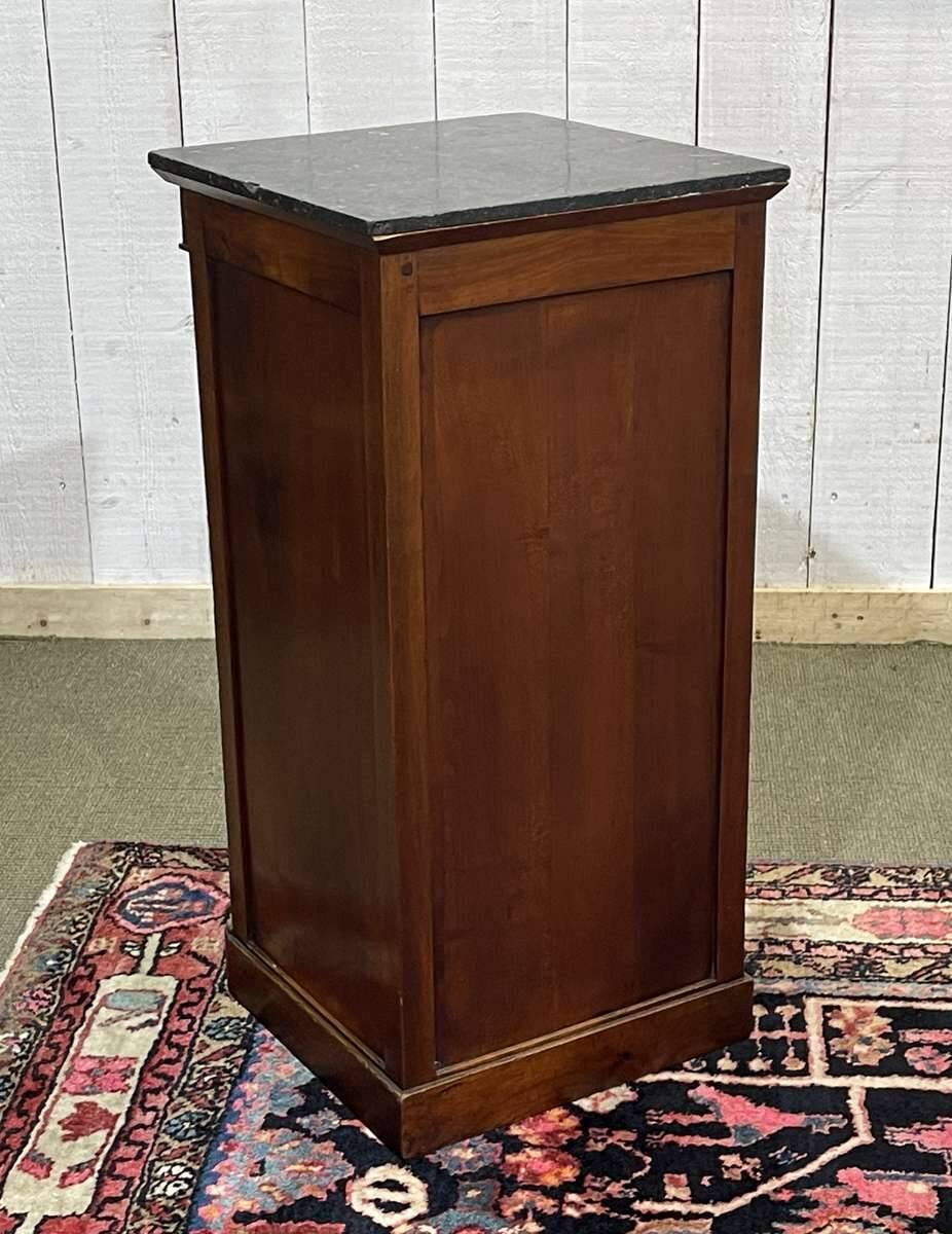 Empire bedside table from the 19th century in cherry wood and black marble.