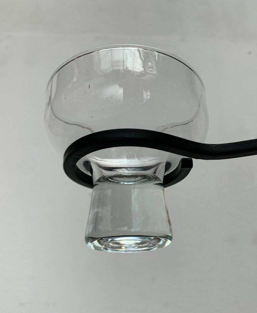 Mid-century metal and glass pendant light from the 1960s.