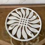 White enameled cast iron trivet