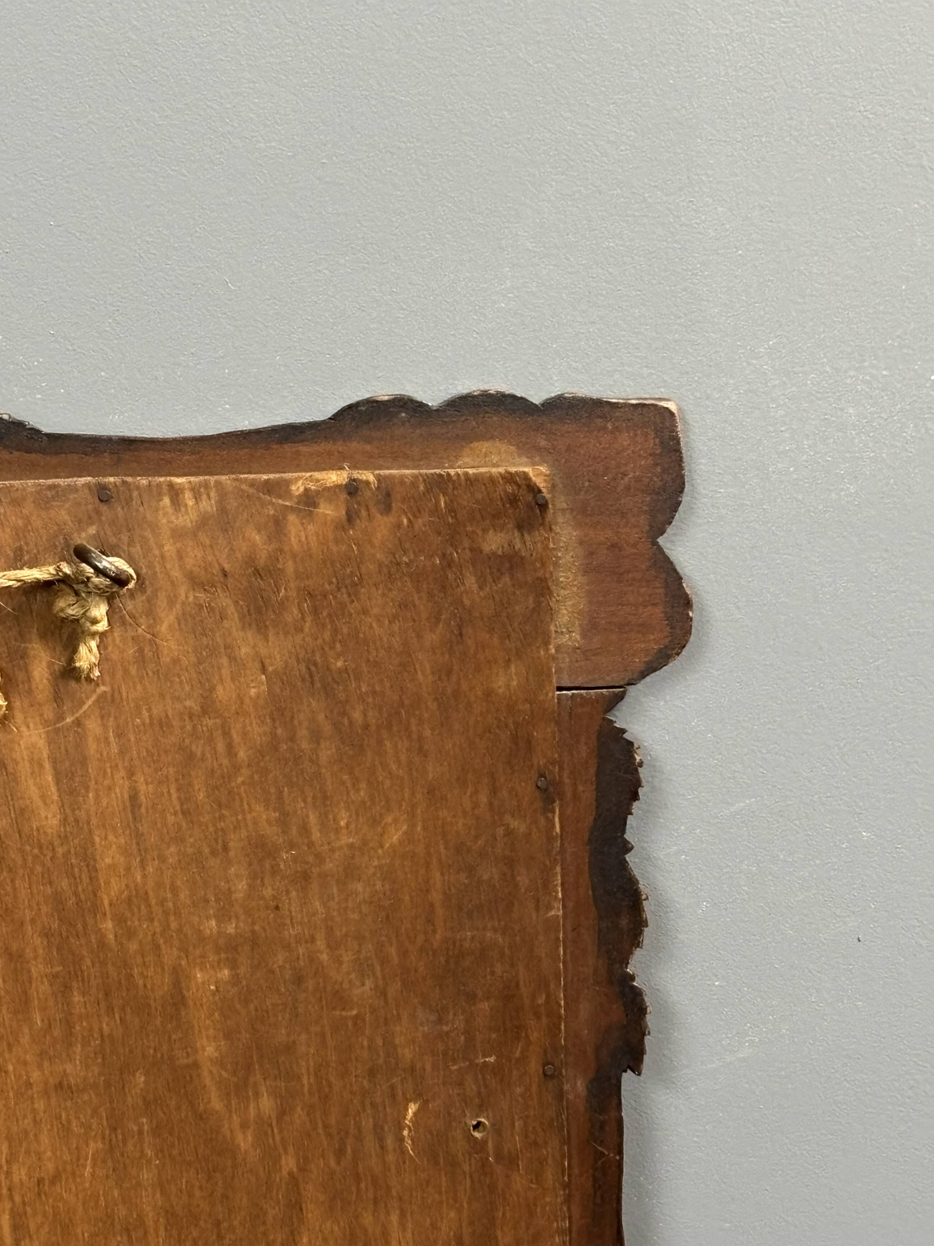 Arts & Crafts hand-carved wall mirror with floral roses, early 20th century