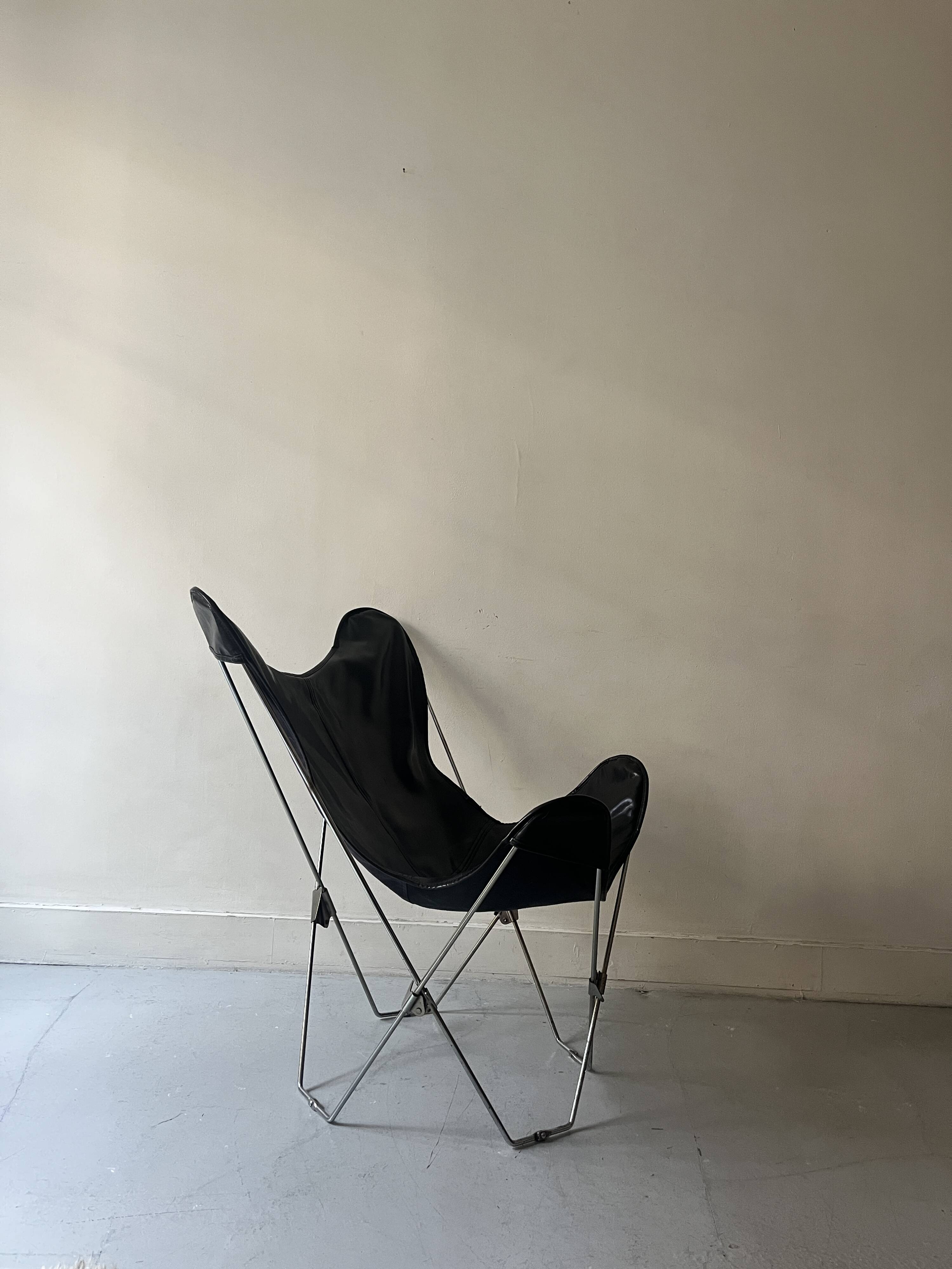 designer butterfly armchair in chrome and black leather