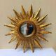 Sun mirror in carved gilded wood from the 1950s