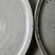 Set of 6 flat plates made of pyrity sandstone, signed