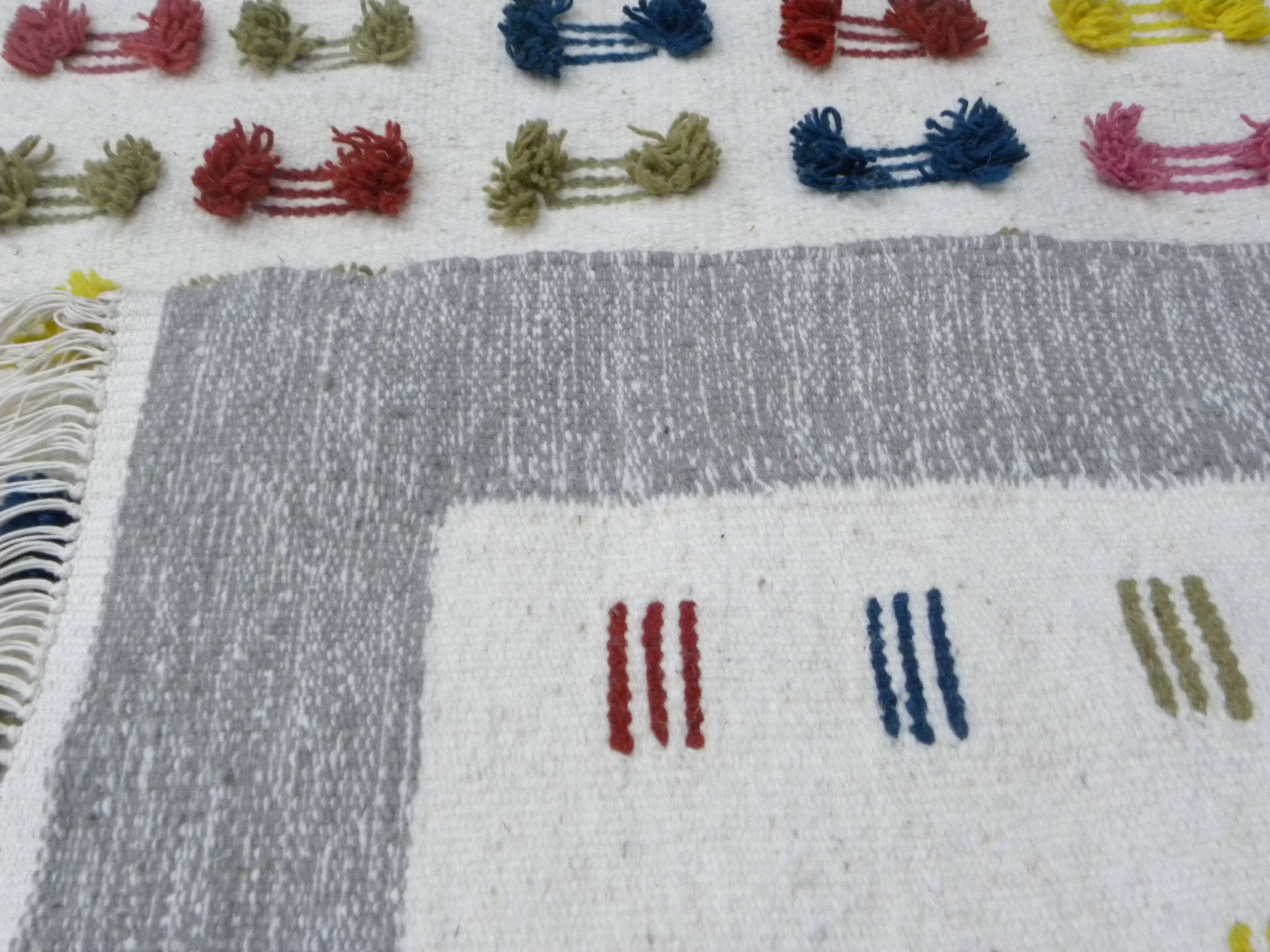 Handwoven Modern Boho Wool Rug with Colourful Patterns and Pompoms