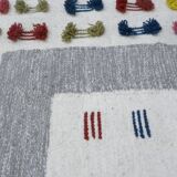 Handwoven Modern Boho Wool Rug with Colourful Patterns and Pompoms