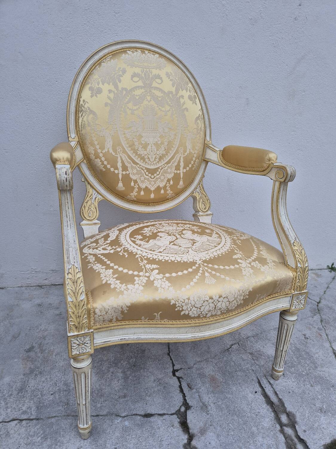 Louis XVI style cabriolet armchair with decorated medallion