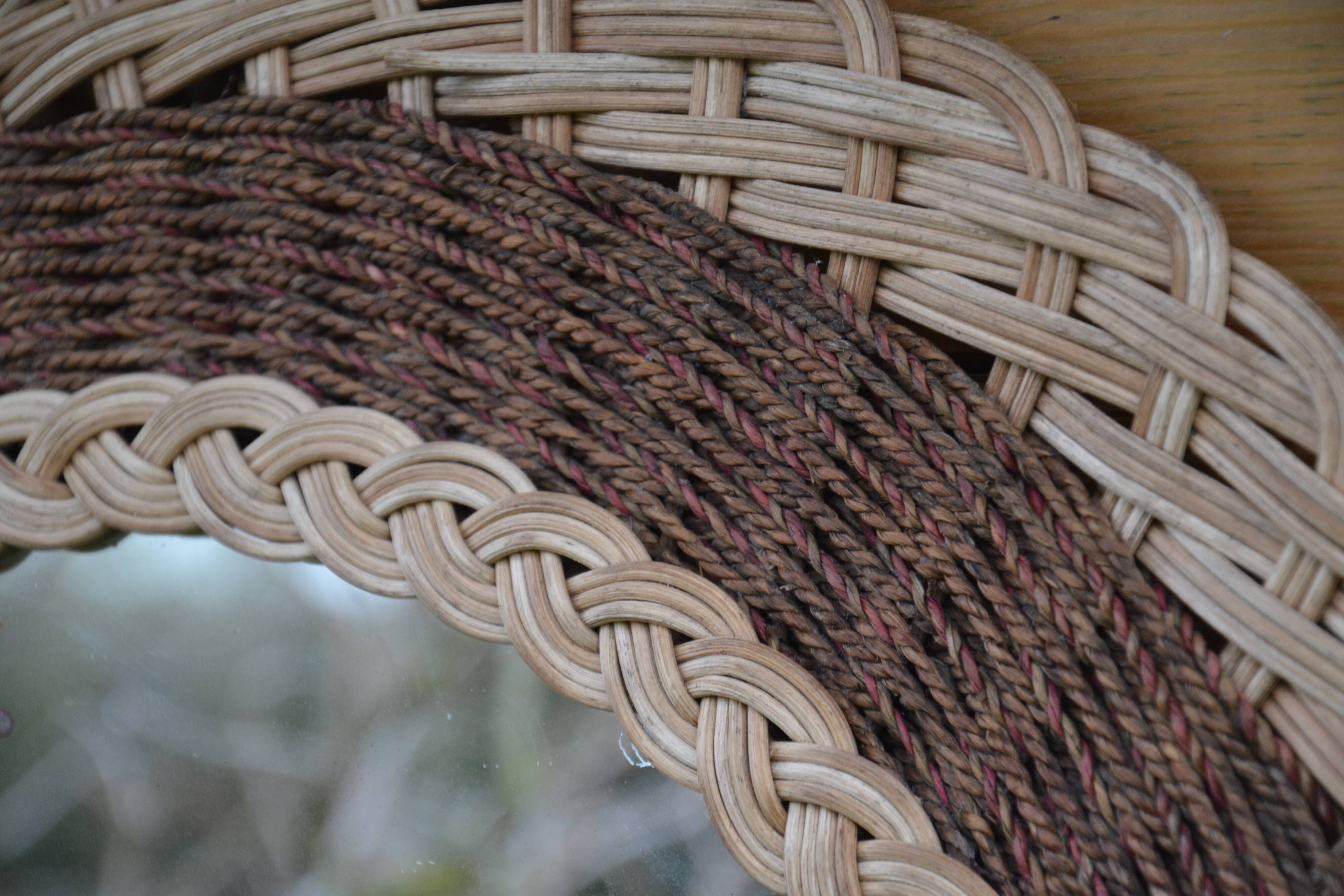 Round woven rattan mirror with rope from the 1970s.