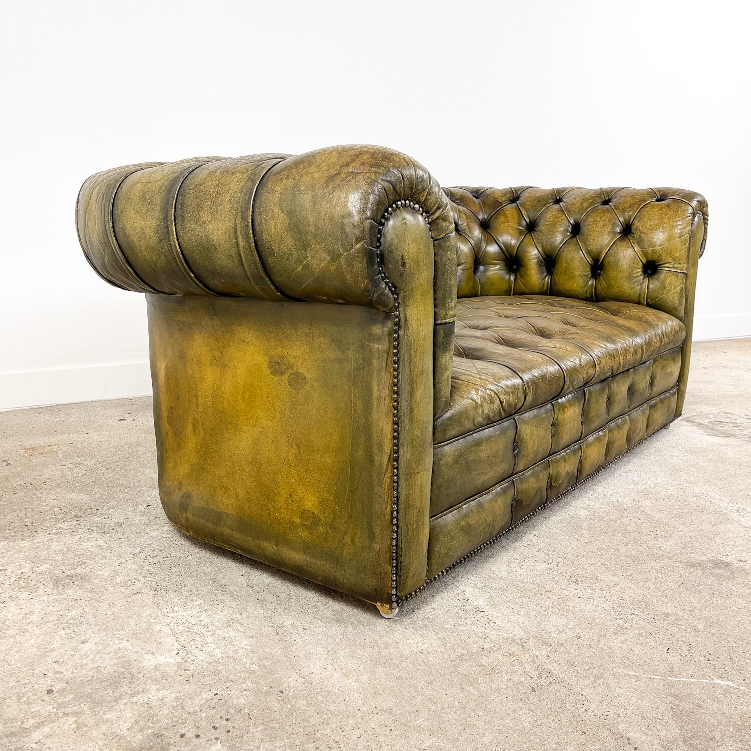 Old vintage leather chesterfield sofa
