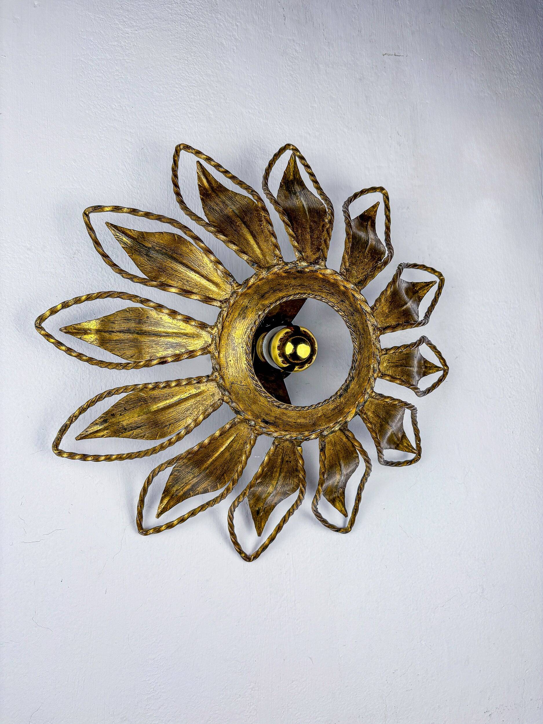 Sunburst ceiling light fixture or sconce, gilt iron & exposed bulb France, 1970s