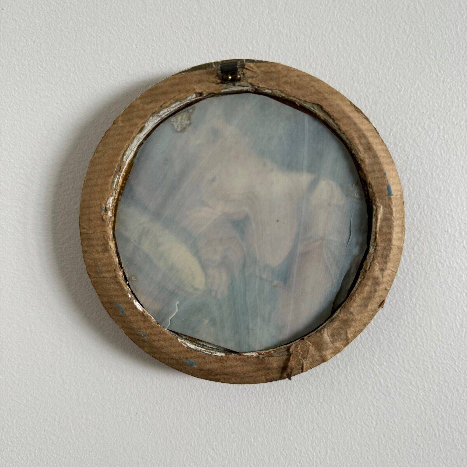 19th century miniature of a young girl with her head resting on a cushion