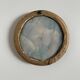 19th century miniature of a young girl with her head resting on a cushion