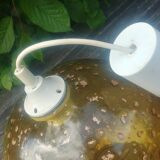 A vintage 70s blown glass pendant light with gold glitter in a globe shape