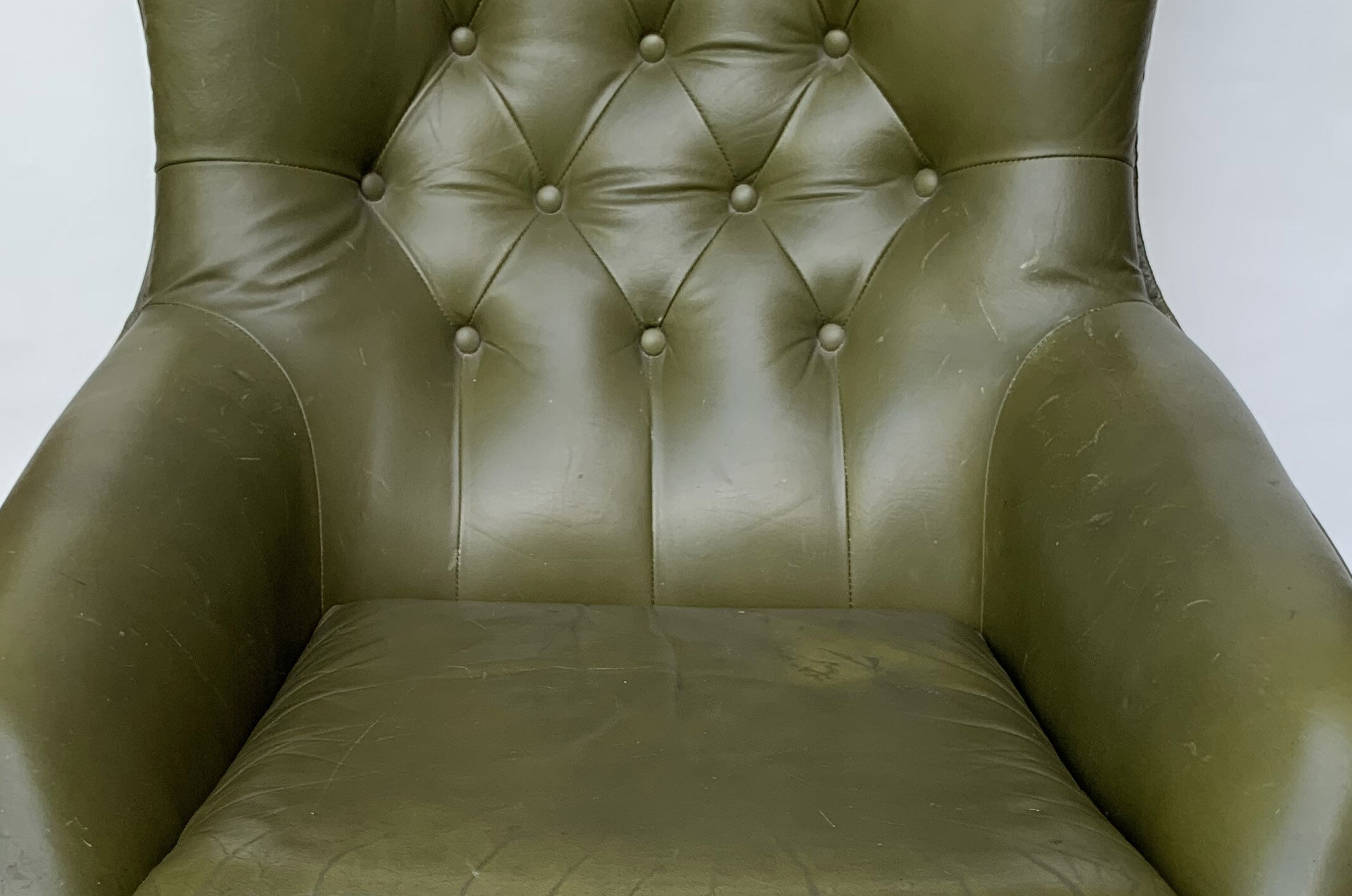 Swivel armchair in olive green leather 1970s