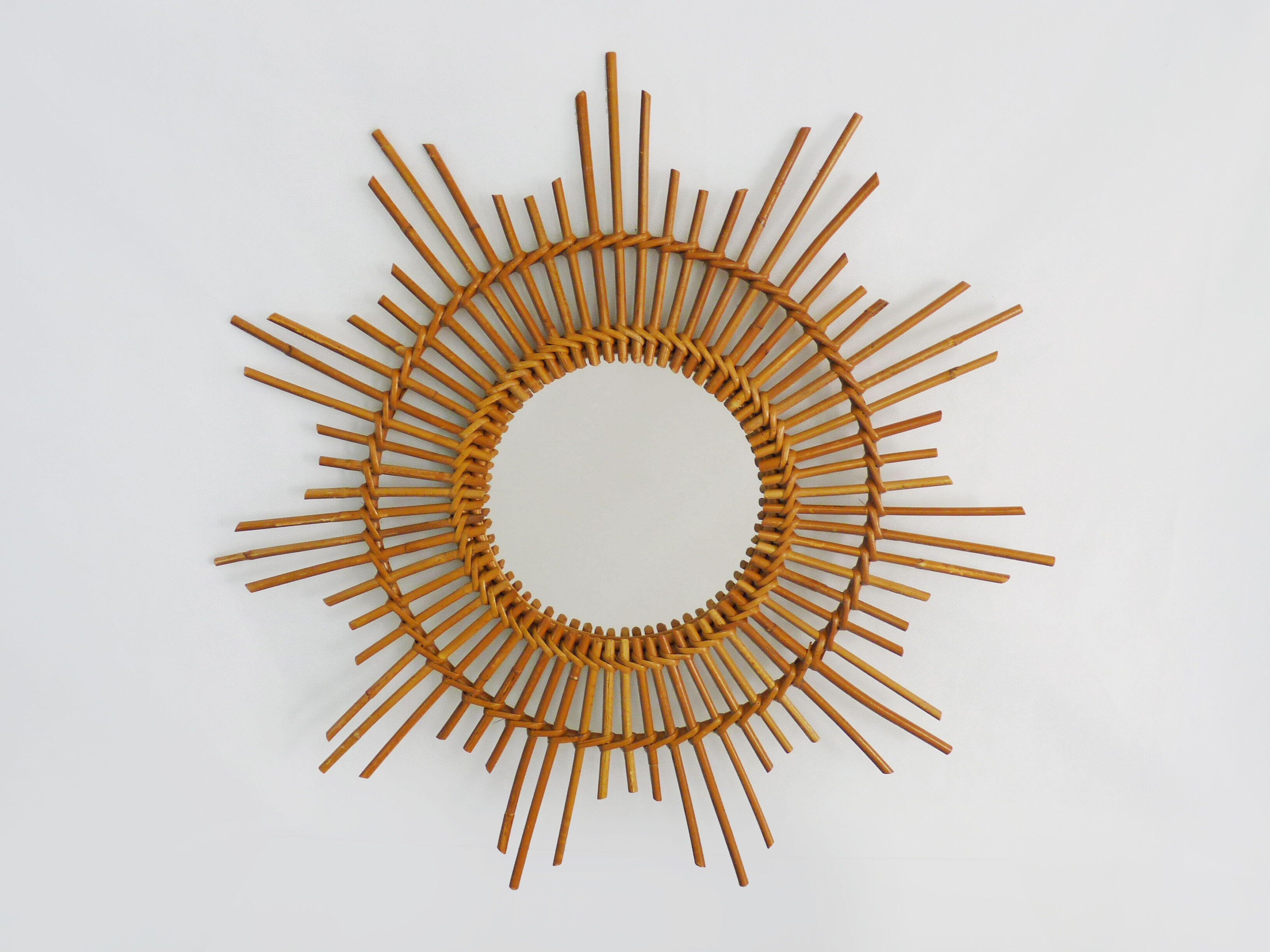 Vintage rattan sun mirror. Year 60