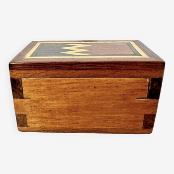 Small wooden box with red interior
