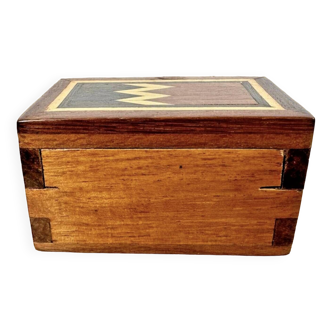 Small wooden box with red interior