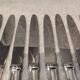 12 silver-plated dessert knives by Platil, rocaille style