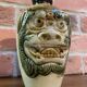 Japanese Awamori Bottle by the Helios Distillery (Okinawa) with Raised Lion and Dragon Design