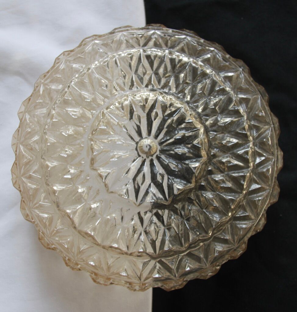 Round ceiling light made of transparent amber glass