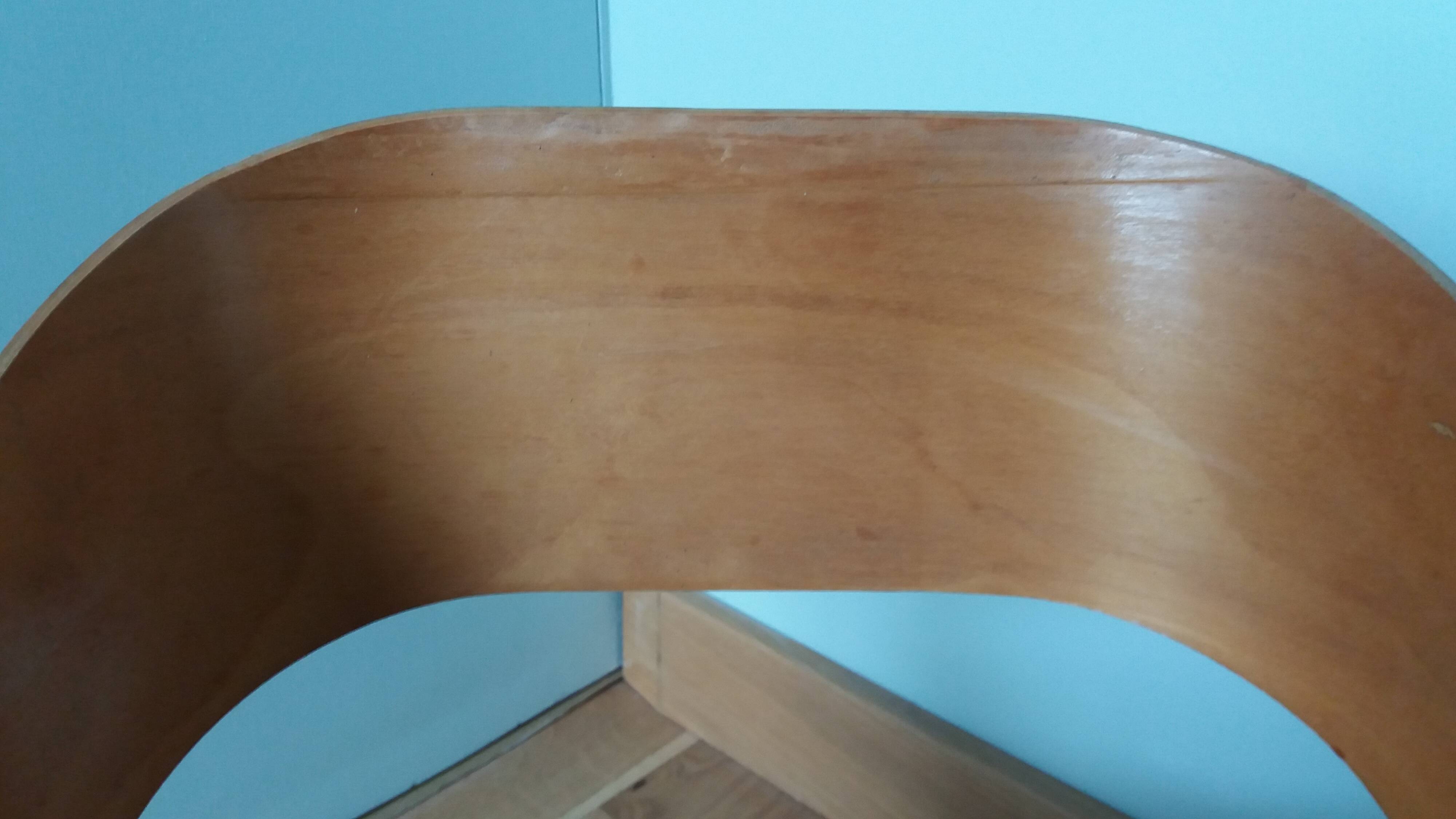 Baumann Baby Coquille children's armchair in bent wood with splayed legs.