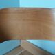 Baumann Baby Coquille children's armchair in bent wood with splayed legs.