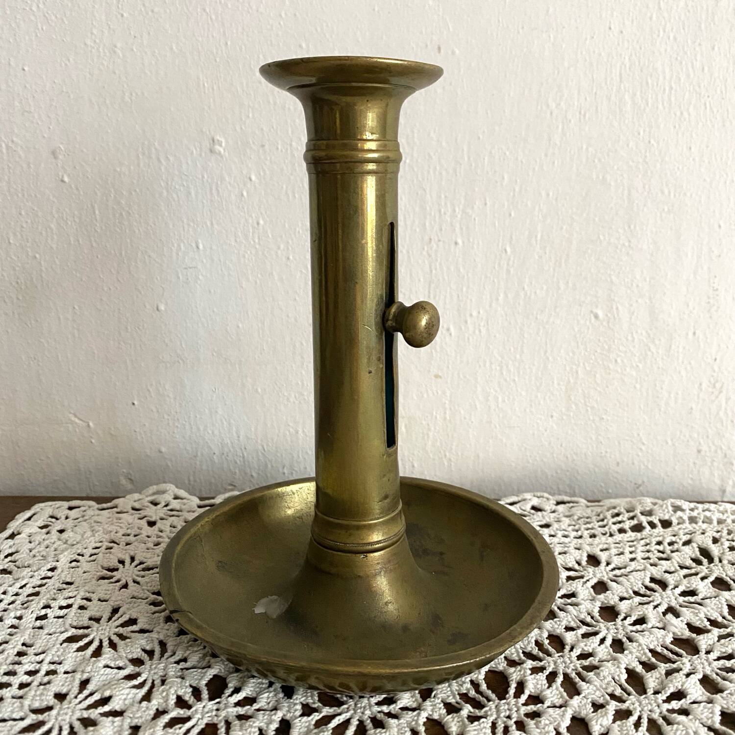 Gold-plated brass push-button candle holder