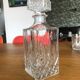 Mismatched decanter and whiskey glasses