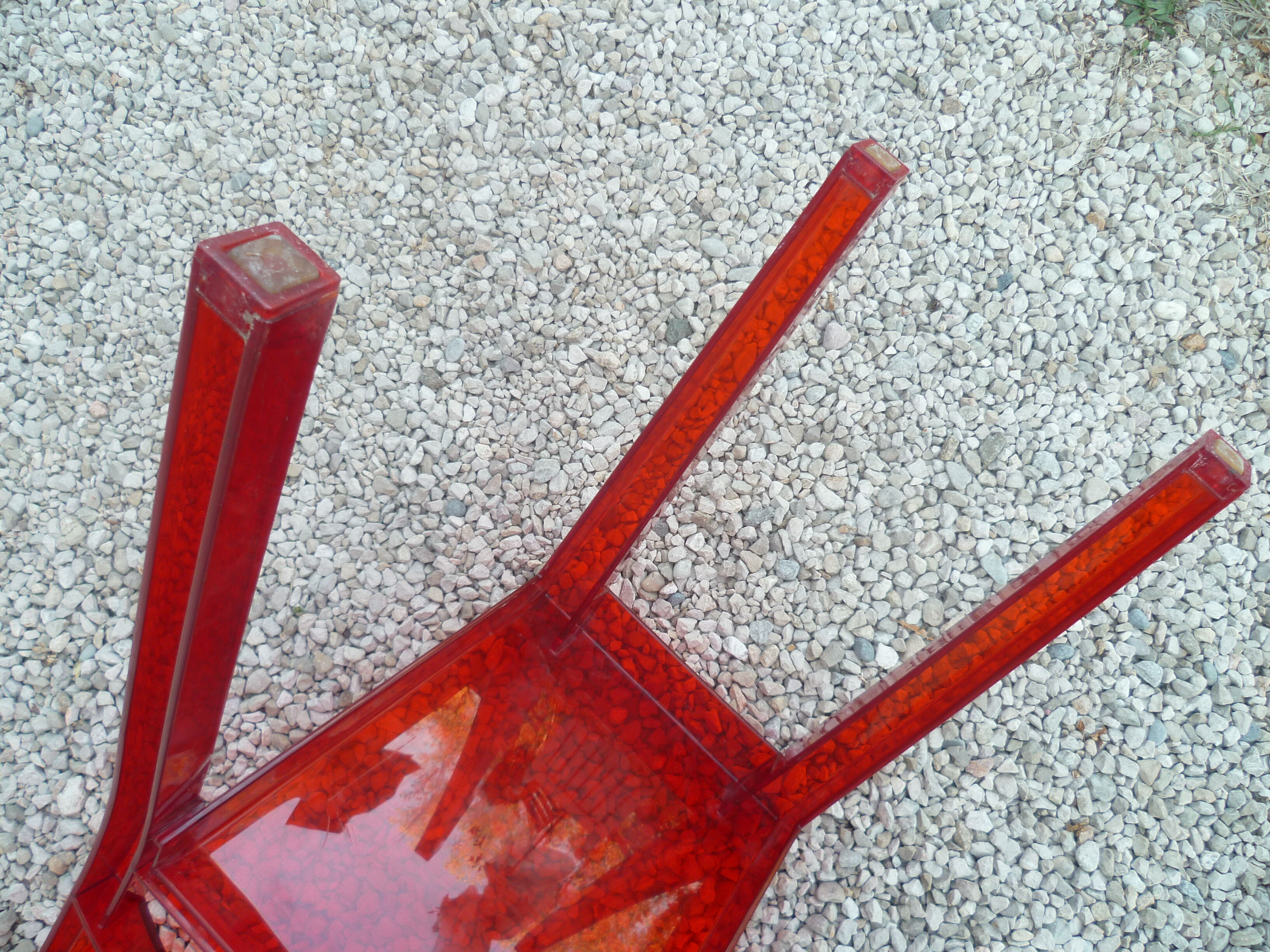 Orange design chair in polycarbonate plexiglass