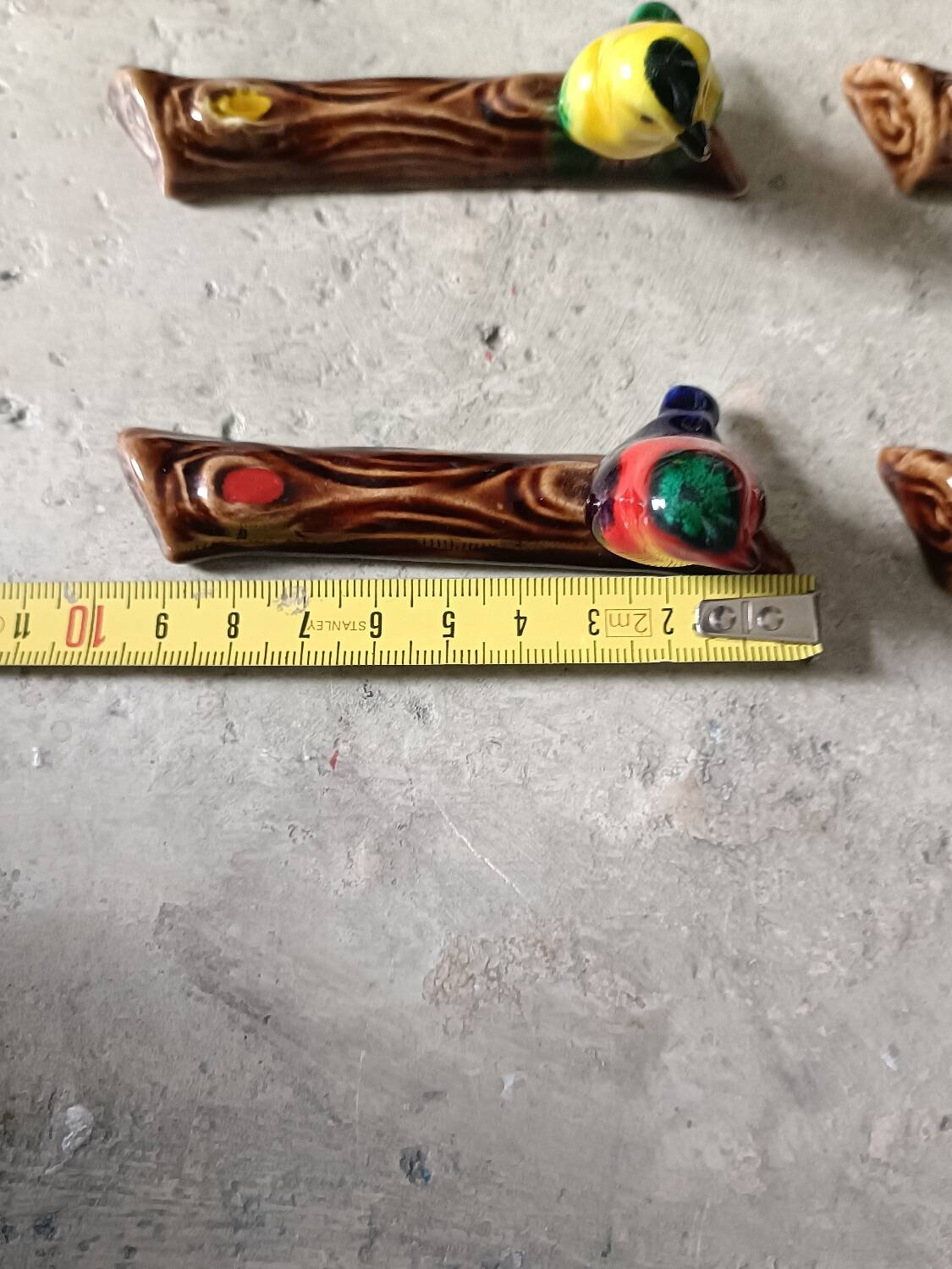 Set of six barbotine bird knife rests