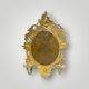 Antique bronze wall sconce with two candlesticks and beveled mirror