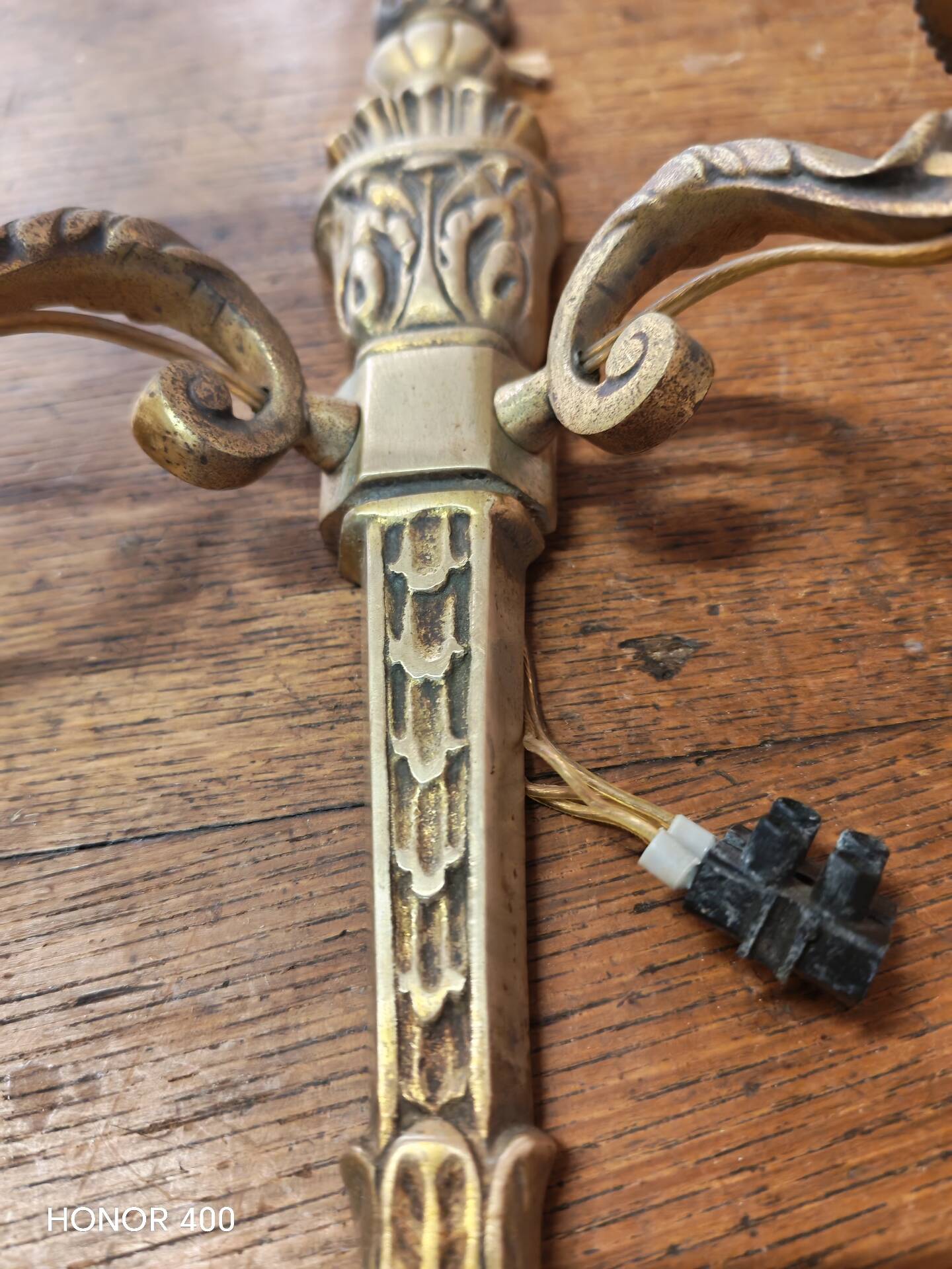 Two antique wall sconces in gilded bronze in the Louis XVI style.
