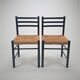 Set of 2 black and straw modernist side chairs, 1960s