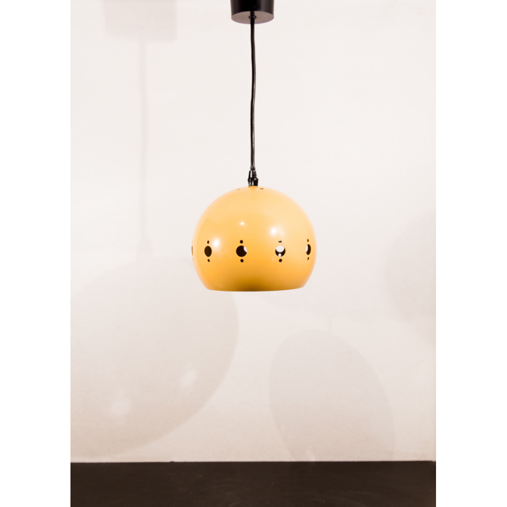 Suspension yellow lacquered metal perforated geometric patterns.